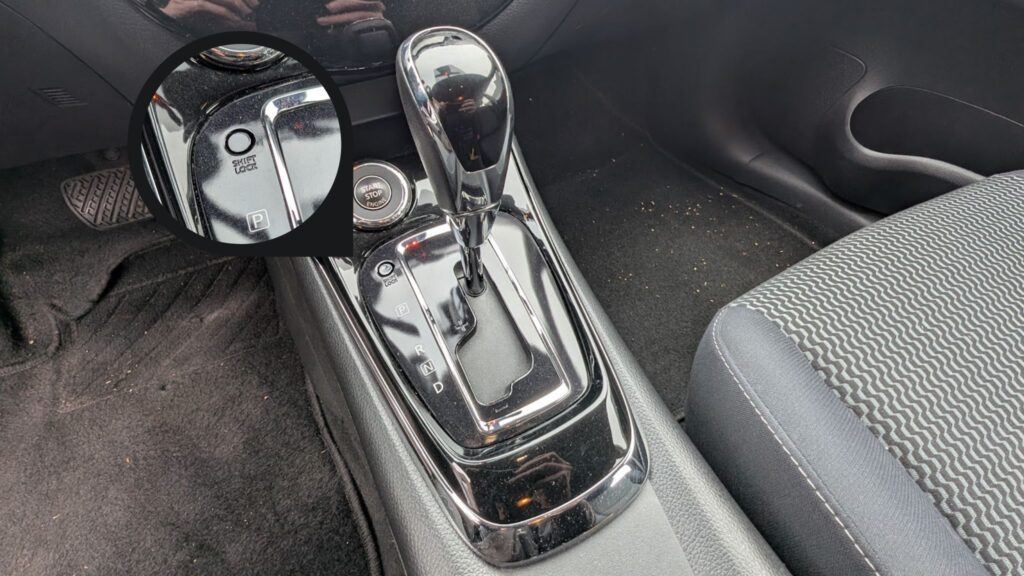 Nissan Pulsar CVT gear lever with shift lock button and emergency release slot