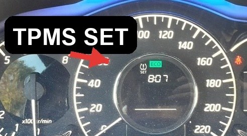 Amber TPMS SET indicator on the Nissan Note E12 cluster display, next to the ECO light