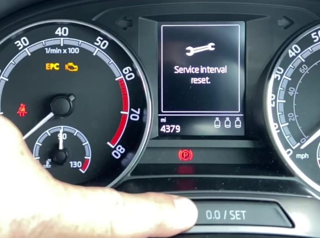 Skoda Fabia Mk3 cluster showing the Service interval reset prompt above the SET button