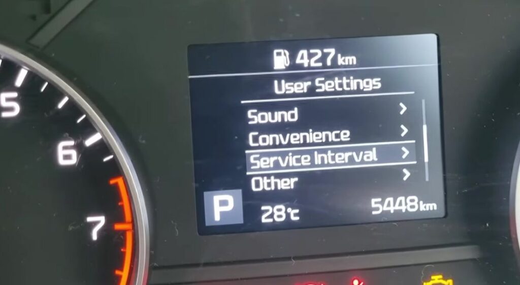 Kia Sportage instrument-cluster User Settings menu with Service Interval highlighted.