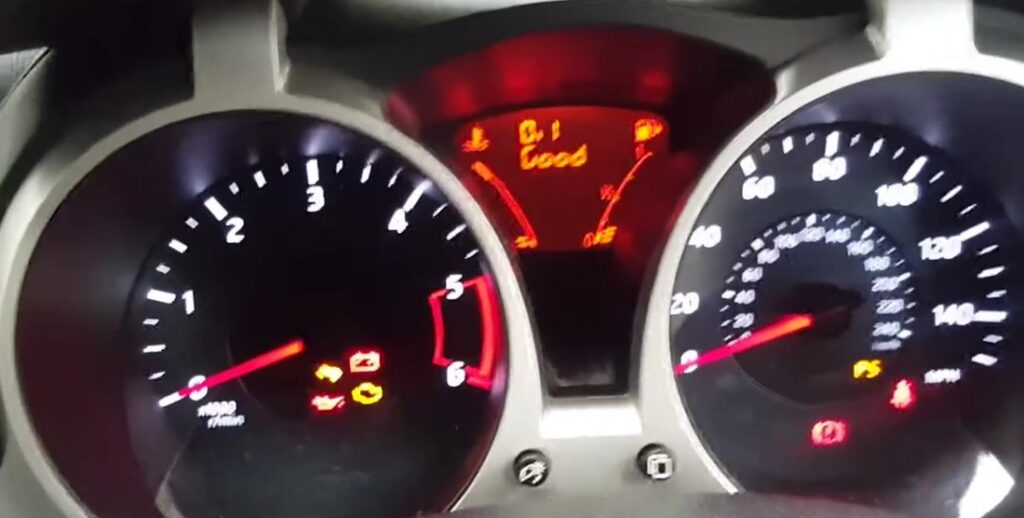Nissan Juke F15 (2010-2019) instrument cluster with the central amber oil-condition/service display reading "Oil Good" after the service indicator reset.