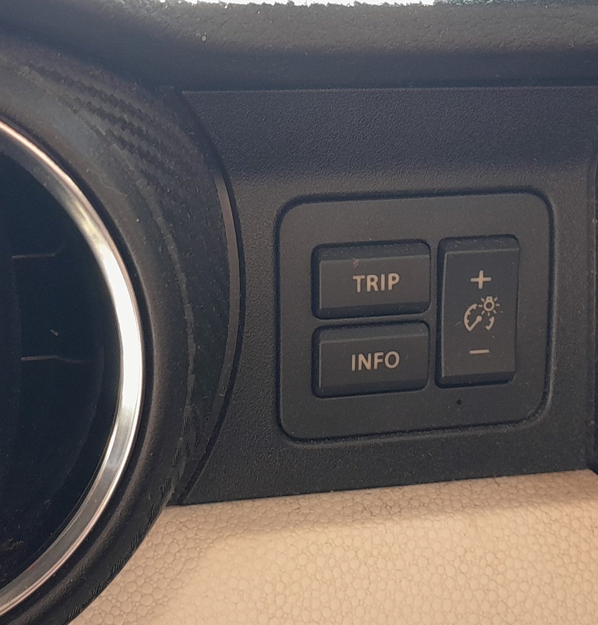 Suzuki Ignis TRIP and INFO cluster buttons beside the dashboard vent
