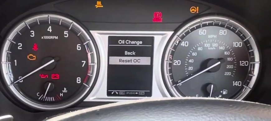 Suzuki Vitara LY display showing Oil Change - Reset OC with the trip stalk button held