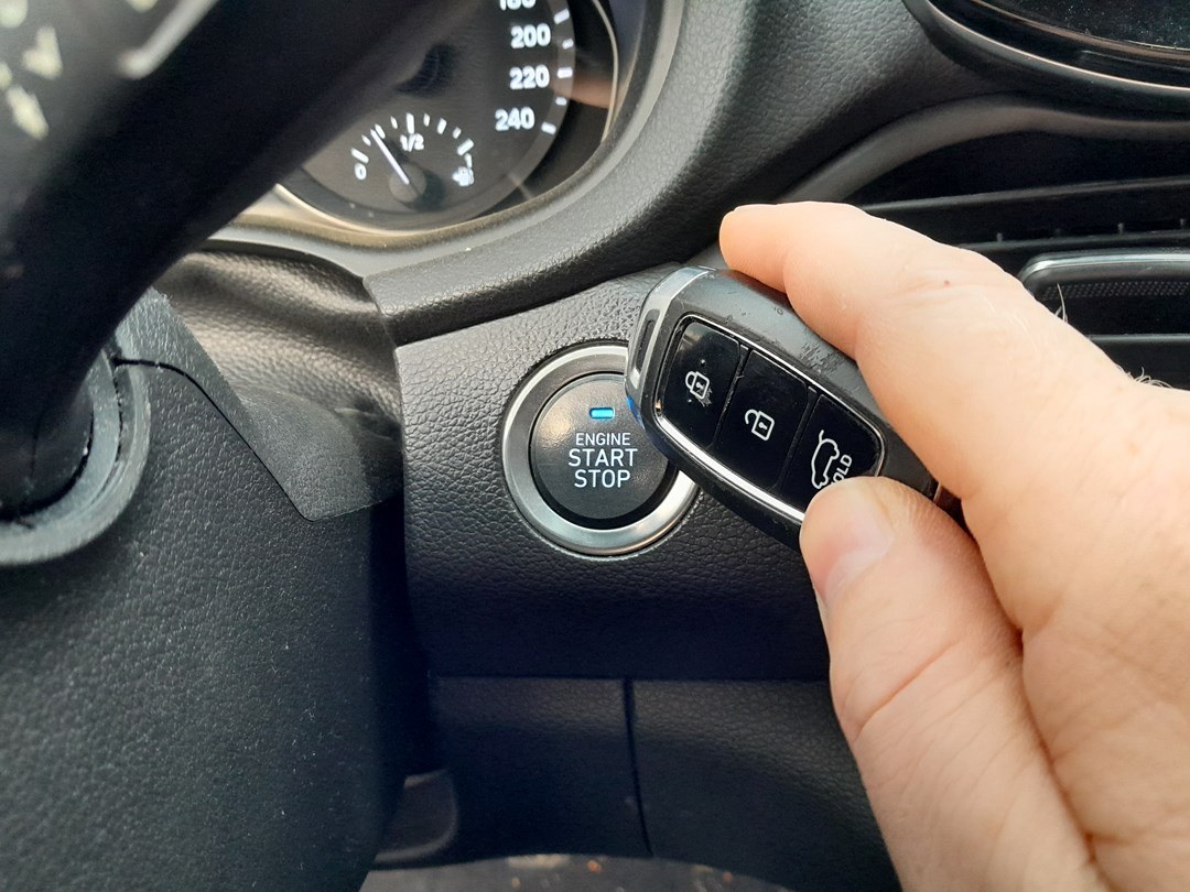 Holding the smart key fob against the Hyundai i30 start button