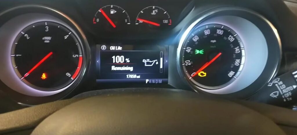 Vauxhall Astra K (Mk7) instrument cluster showing the Driver Information menu Oil Life screen at 100% Remaining after a service reset.