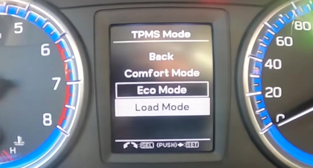 Suzuki S-Cross cluster TPMS Mode menu showing Comfort Eco and Load Mode options