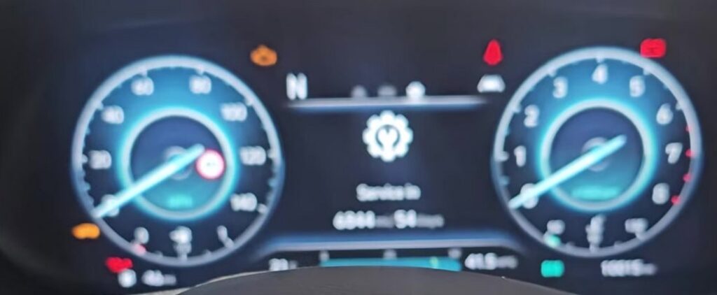 Hyundai i20 Mk3 digital cluster showing Service in 6844 miles reminder