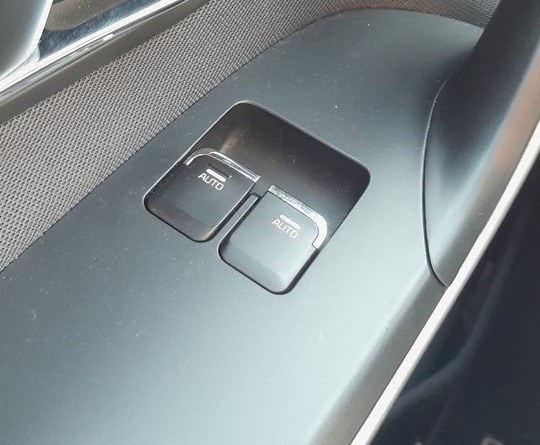 Kia Ceed driver door power window switch marked AUTO