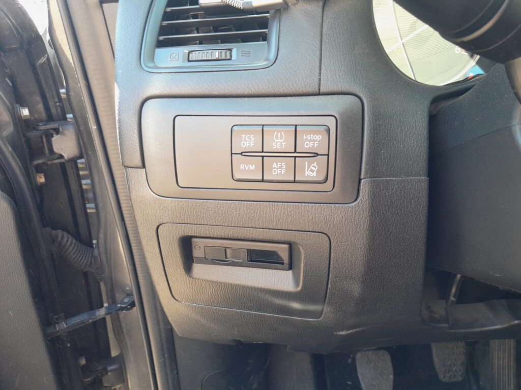 Mazda CX-5 Mk1 i-stop OFF button on the dashboard with its indicator.