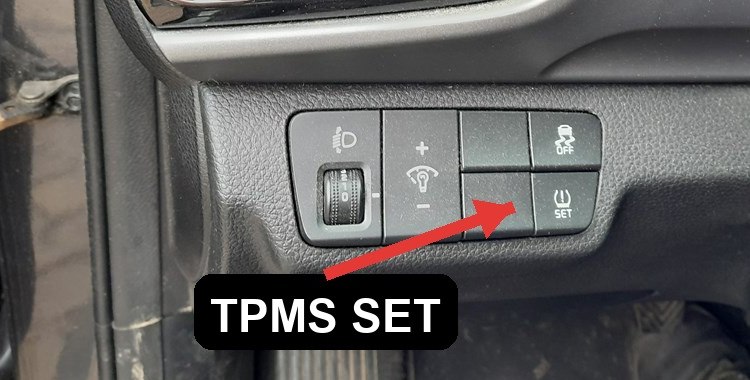 Kia Stonic TPMS SET button on the dashboard switch panel
