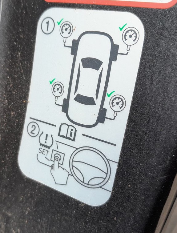 Kia Stonic door-pillar TPMS reset instruction label
