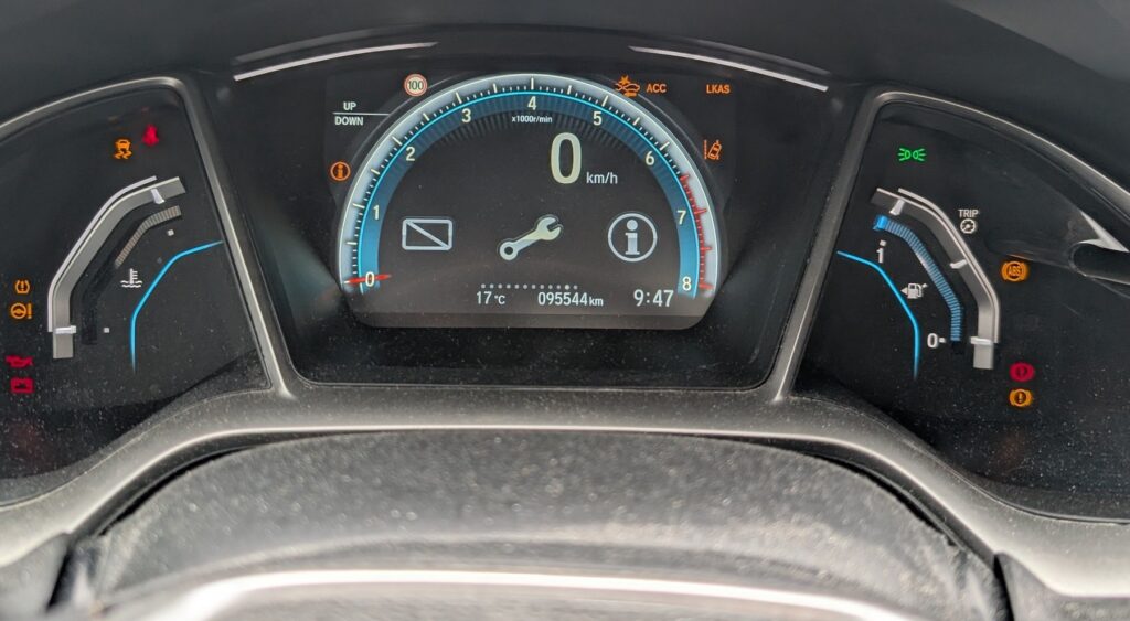 Honda Civic Mk10 instrument cluster showing the maintenance wrench indicator
