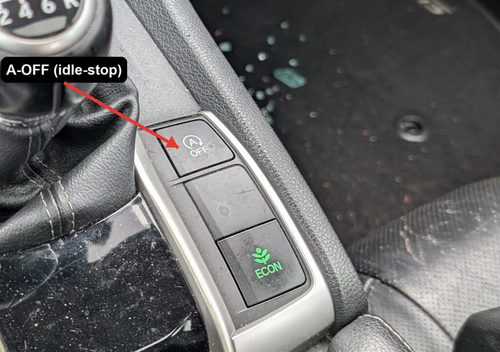 A-OFF auto idle-stop button beside the Honda Civic Mk10 gear shifter