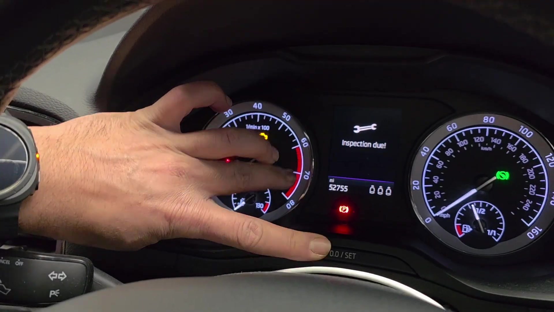 Skoda Karoq analog instrument cluster showing Inspection due with the 0.0/SET reset button