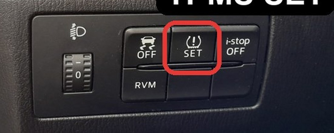 Mazda 3 (BM) TPMS SET button on the lower dash