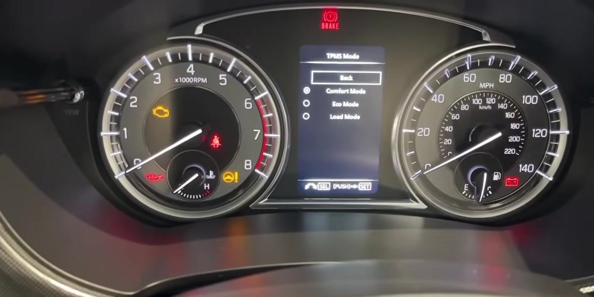 Suzuki Vitara LY instrument cluster showing the TPMS Mode menu with Comfort, Eco and Load options