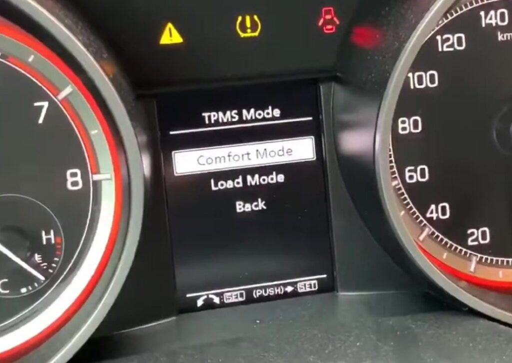 Suzuki Swift Mk4 TPMS Mode menu showing Comfort Mode and Load Mode options.