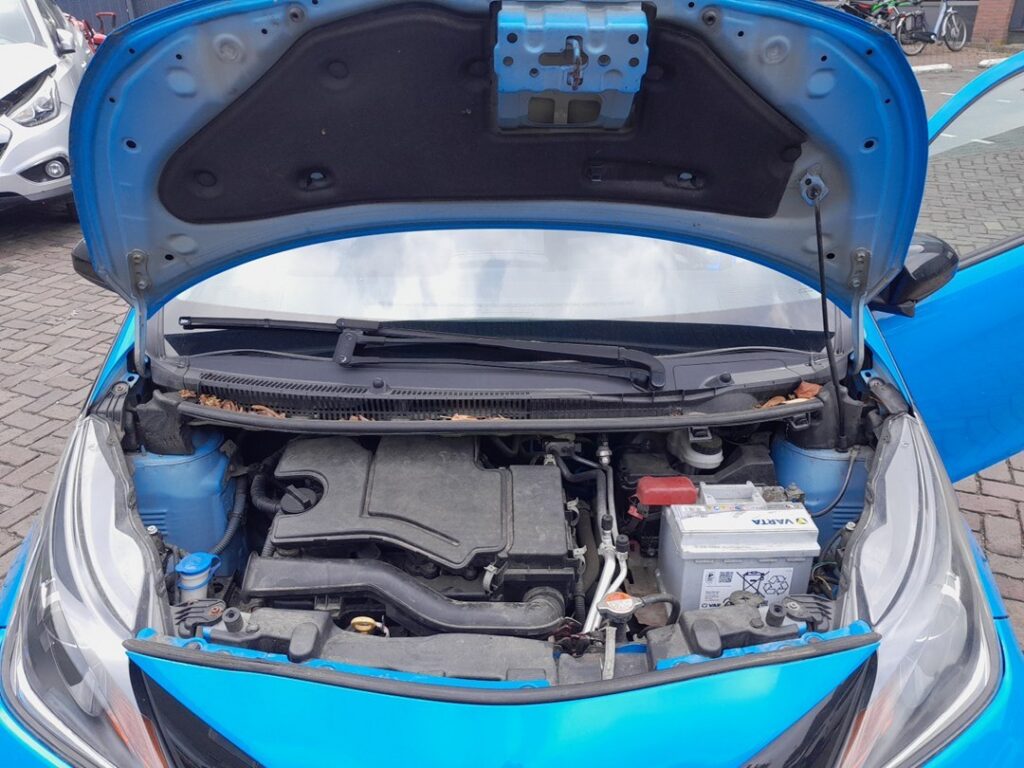 Twelve-volt battery in the engine bay of the Toyota Aygo Mk2 (B40)
