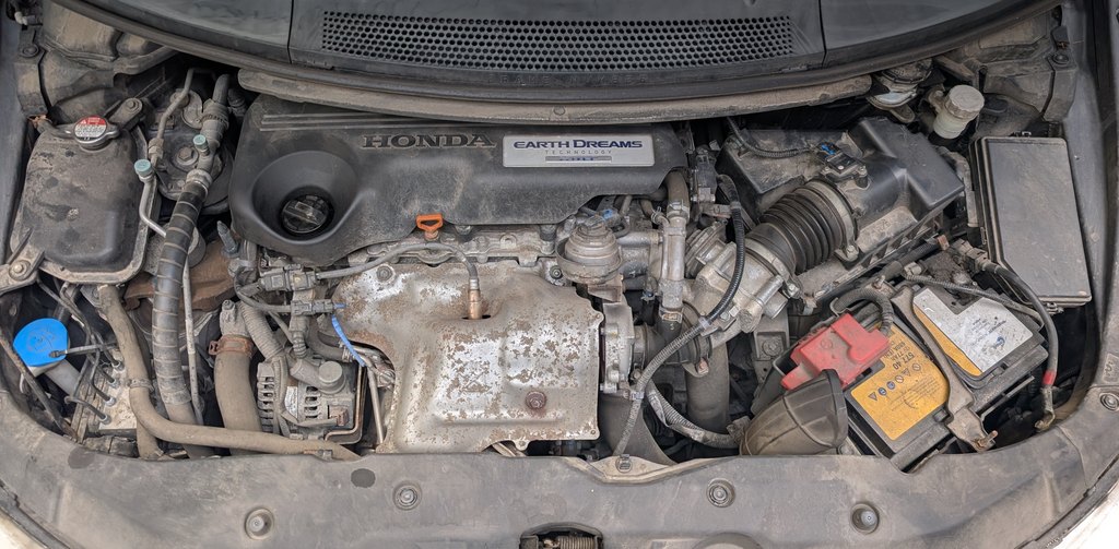 12V battery in the engine bay of the Honda Civic (FK)