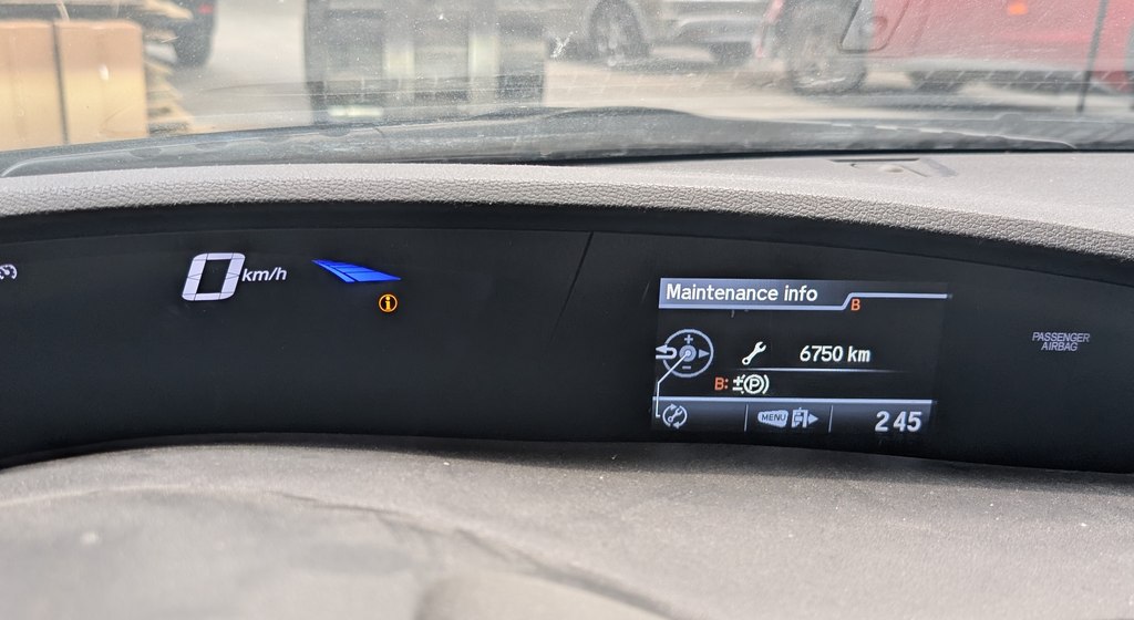 Maintenance info screen on the Honda Civic (FK) i-MID showing the service reminder