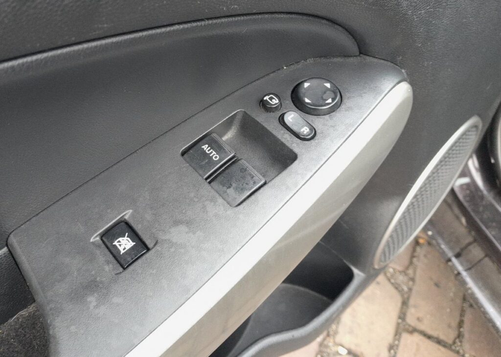 Mazda 2 DE driver door window switch panel with AUTO switch
