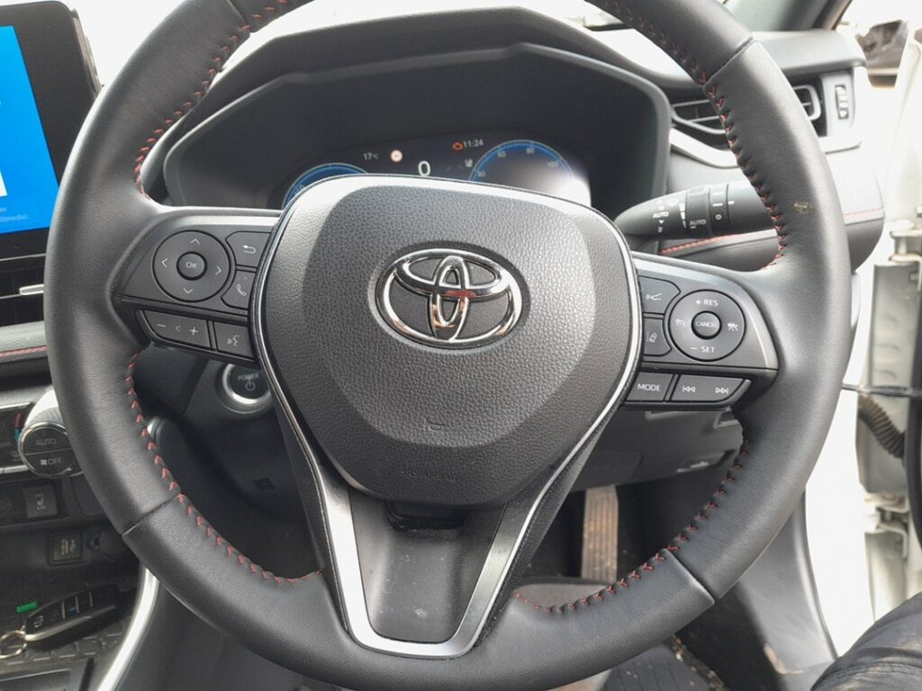 Engine POWER start button beside the steering wheel on the Toyota RAV4 Mk5 (XA50)
