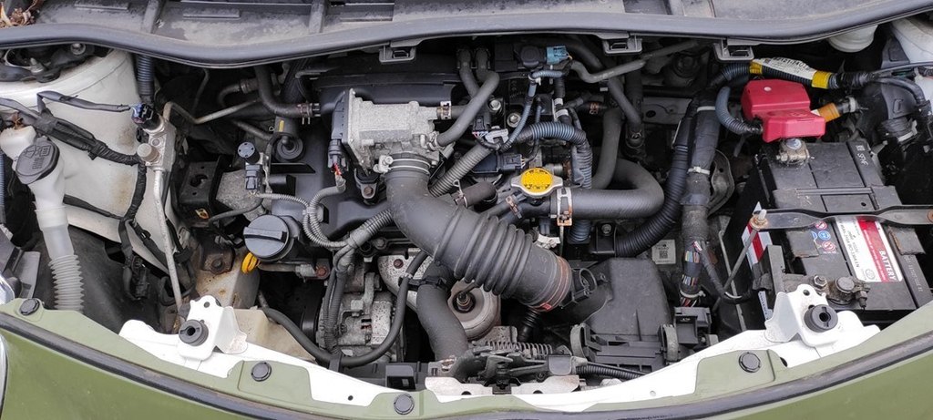 12V battery in the engine bay of the Toyota iQ (J10)