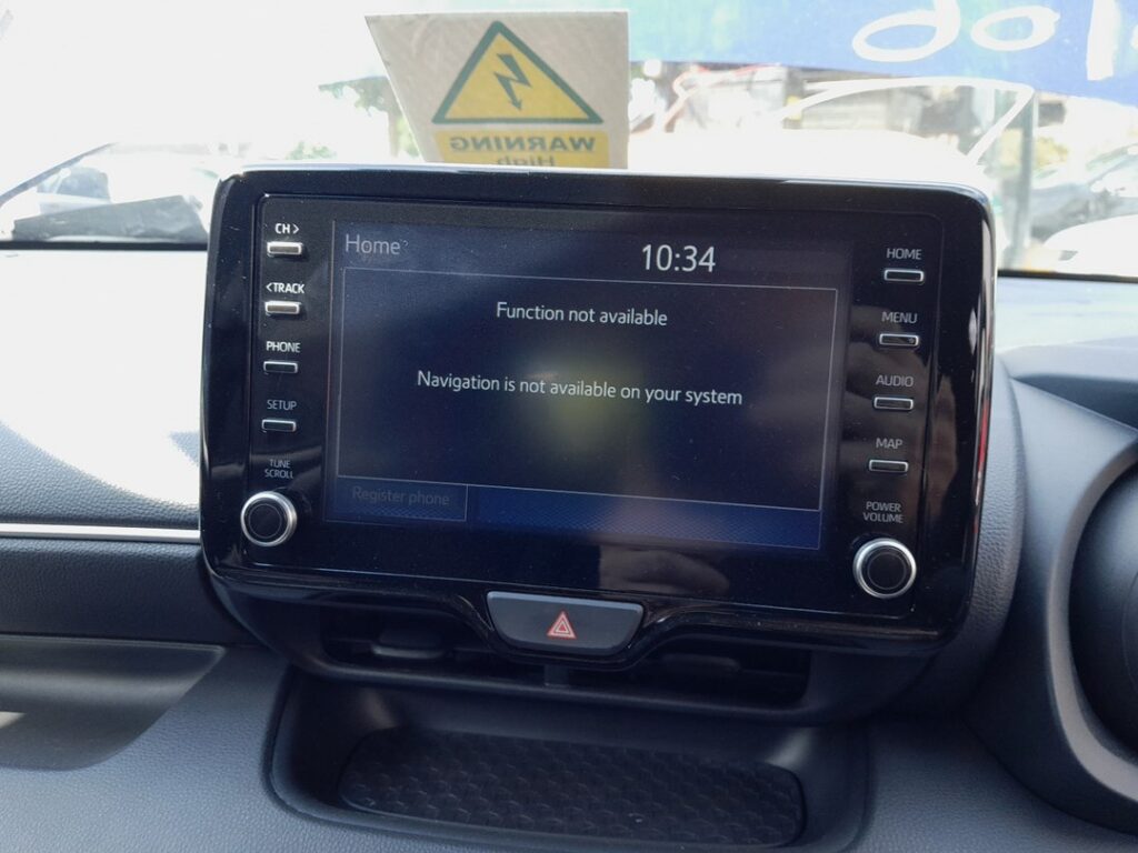 Touchscreen head unit on the Toyota Yaris Mk4 (XP210) showing a function-not-available message
