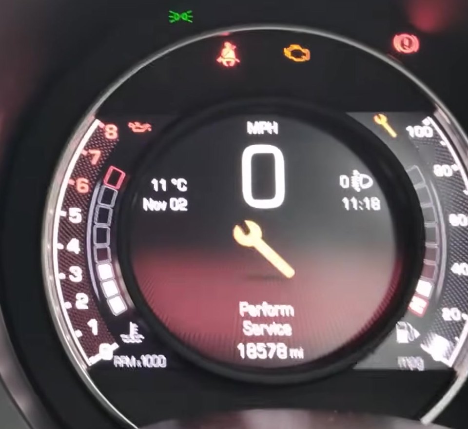 Abarth 595 instrument cluster showing the Perform Service wrench warning