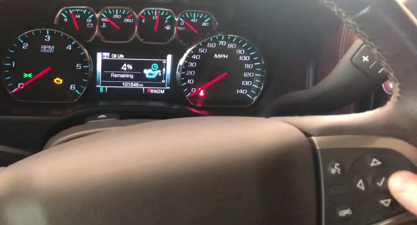 Chevrolet Silverado K2XX Driver Information Center showing Oil Life Remaining, with the steering-wheel checkmark and arrow buttons