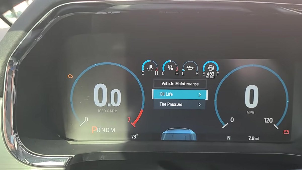 Ford F-150 P702 digital instrument cluster showing the Vehicle Maintenance menu with Oil Life highlighted