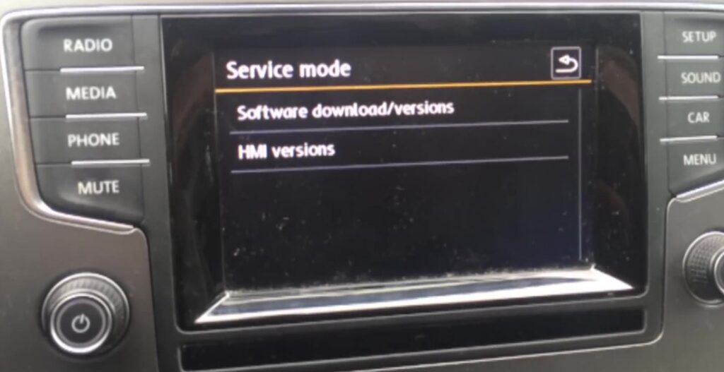 VW Golf Mk7 radio showing the hidden Service mode menu with Software download/versions and HMI versions