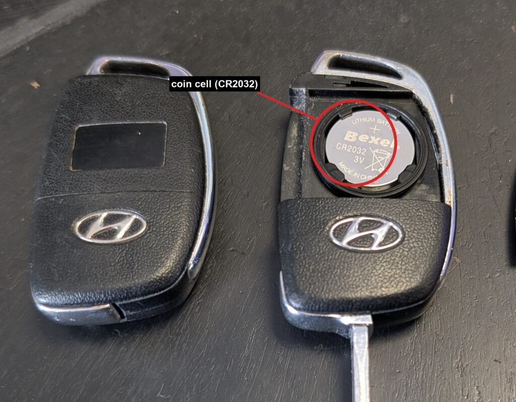 Hyundai ix35 flip key opened showing the CR2032 coin cell