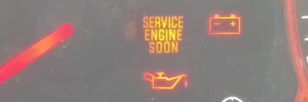 Nissan Juke F15 cluster showing Service Engine Soon, battery and oil warning lights with the ignition on