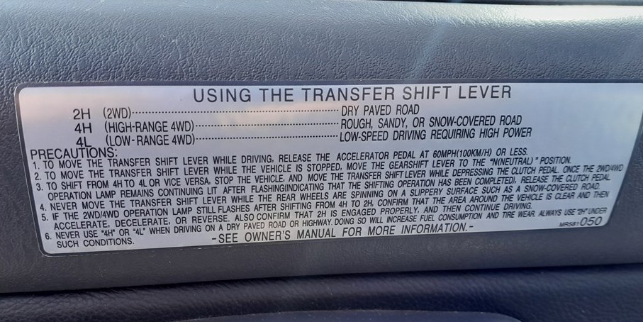 Mitsubishi L200 transfer shift lever decal showing 2H, 4H and 4L four-wheel-drive modes