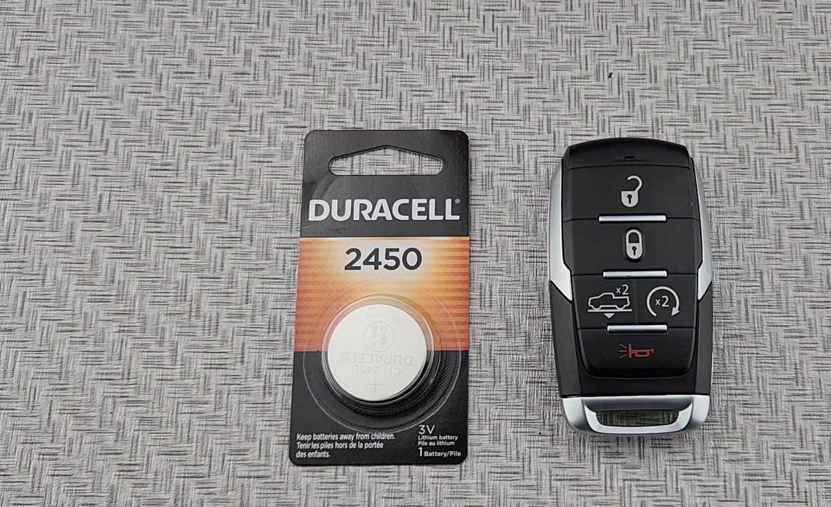 RAM 1500 DT proximity smart key next to a Duracell CR2450 coin cell