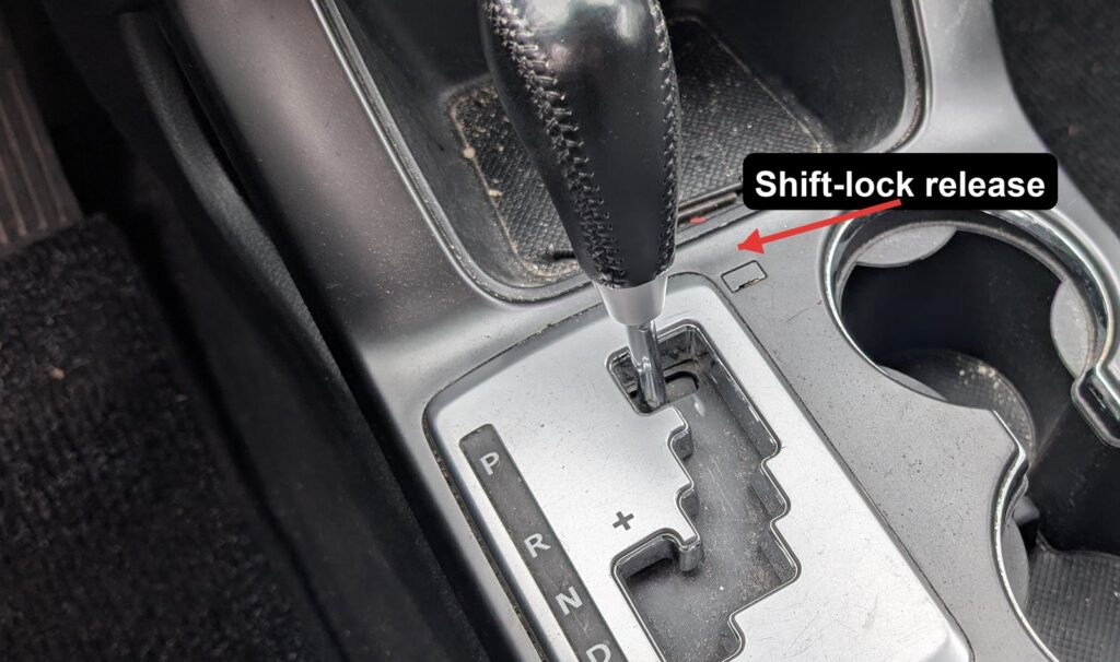 Kia Sorento XM gear selector with the shift-lock release slot next to P