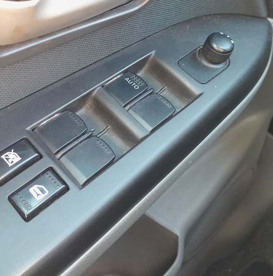 Suzuki SX4 driver door power window switch marked AUTO