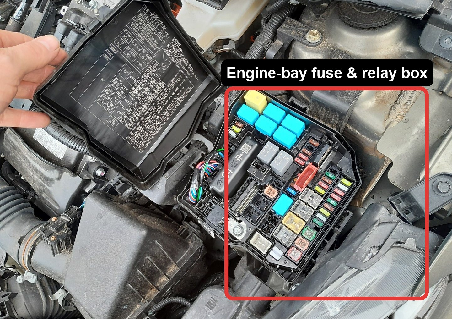 Toyota Yaris engine-bay fuse and relay box with the lid legend visible