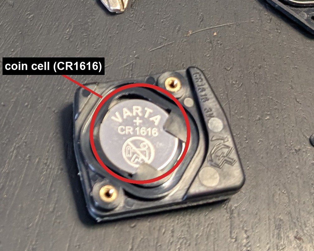 Toyota remote-head key opened, showing the CR1616 coin cell