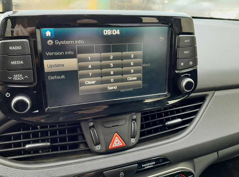 Hyundai i30 Display Audio System Info screen with the numeric keypad for the Dealer Mode access code