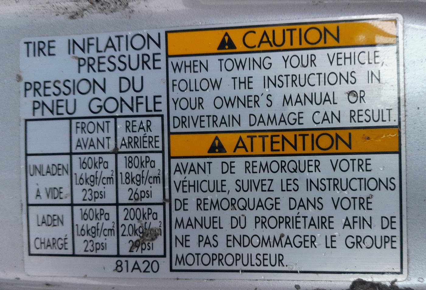 Tire pressure placard on a Suzuki Jimny door pillar