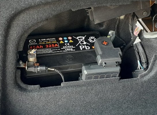 Mazda 6e 12-volt lead-acid battery in the trunk, 45Ah 325A