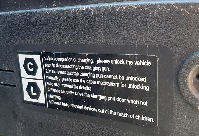 Instruction label inside the Mazda 6e charge flap