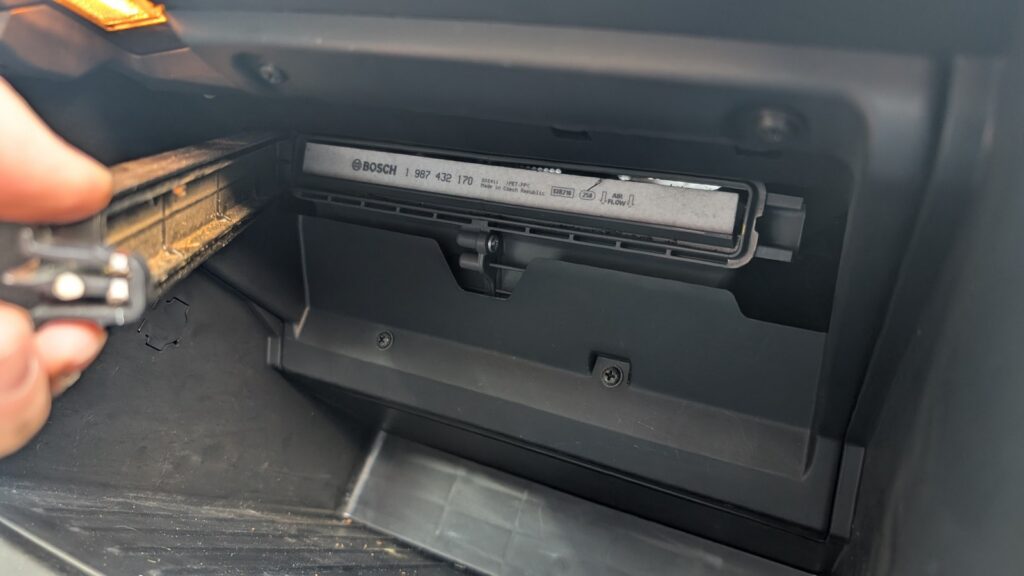Removing the cabin filter cover on a Kia Rio Mk3