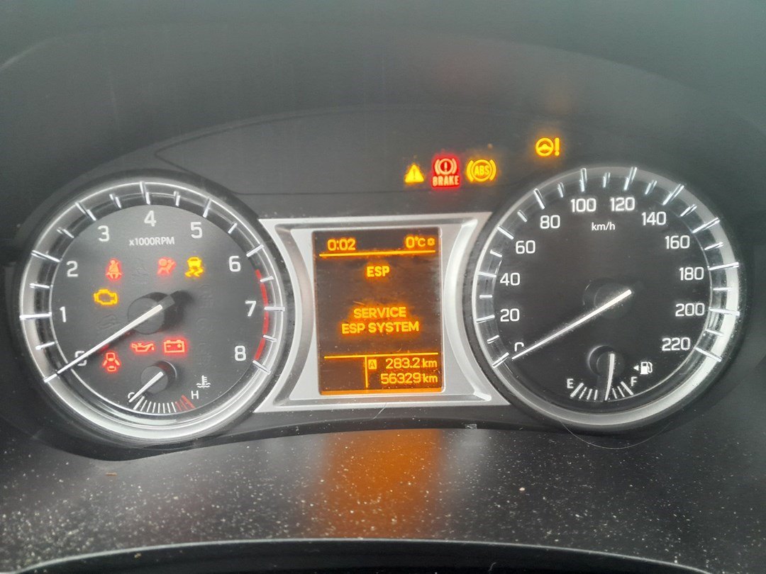 Suzuki Vitara LY instrument cluster with several warning lights illuminated